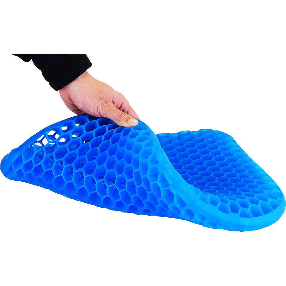 Hand holding blue honeycomb gel seat cushion
