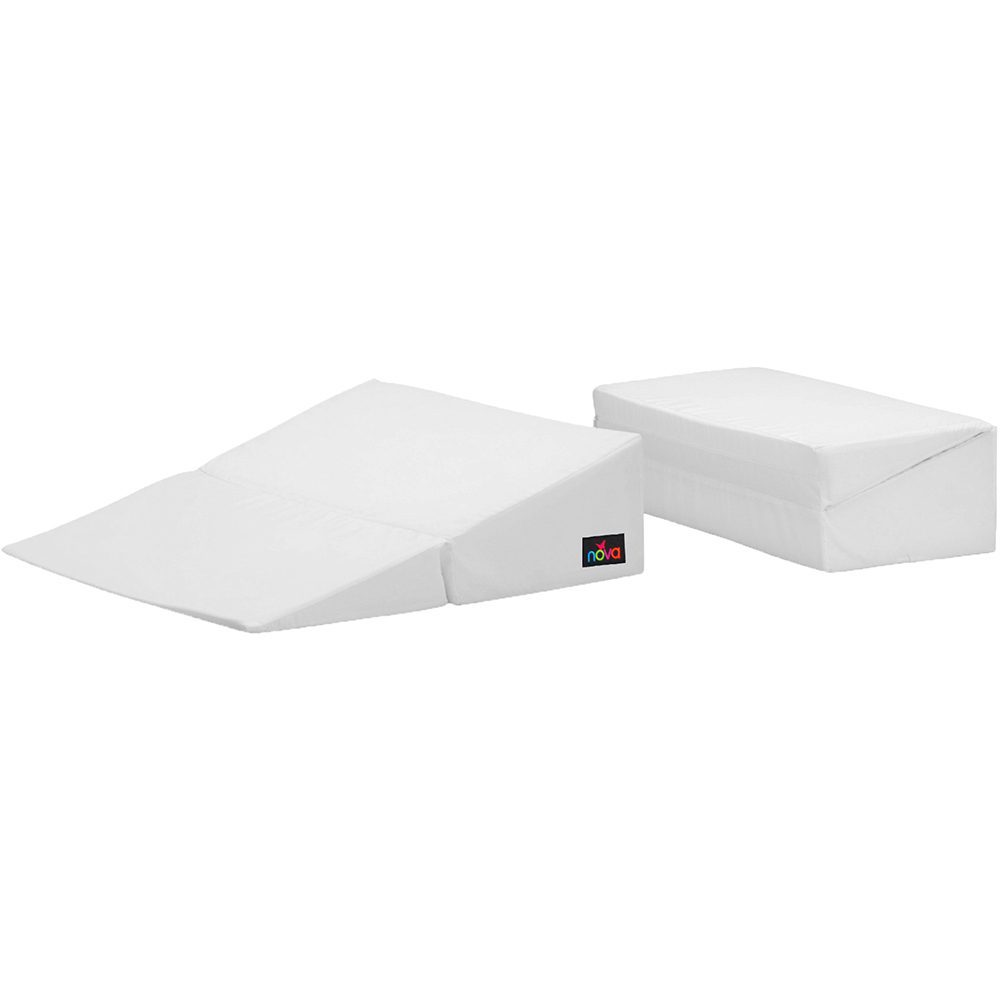 Two white foam wedge pillows