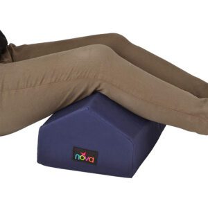 Legs elevated on blue wedge pillow