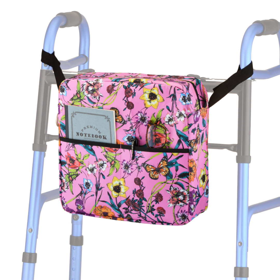 Pink floral storage bag attached to walker