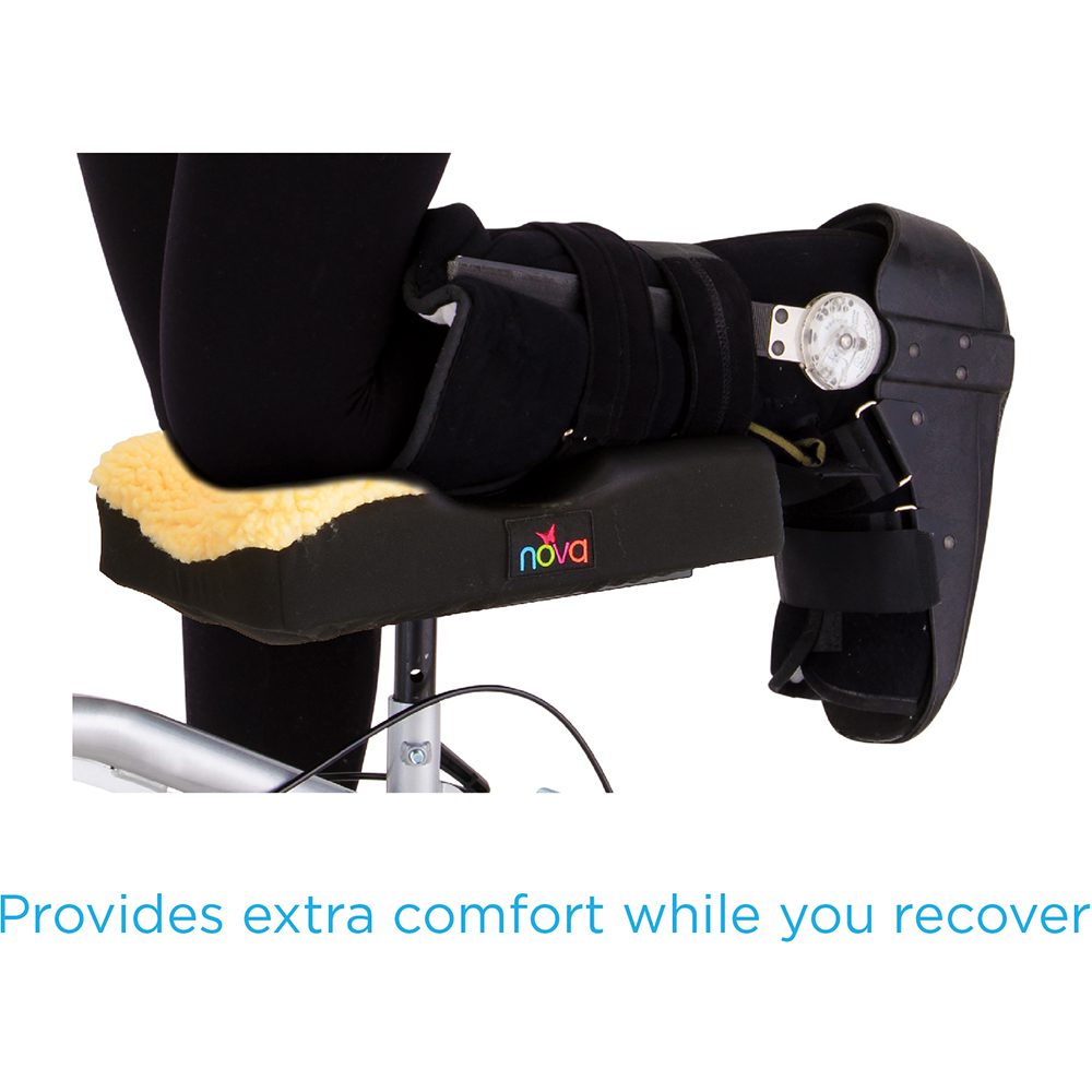 Leg in walking boot on recovery cushion