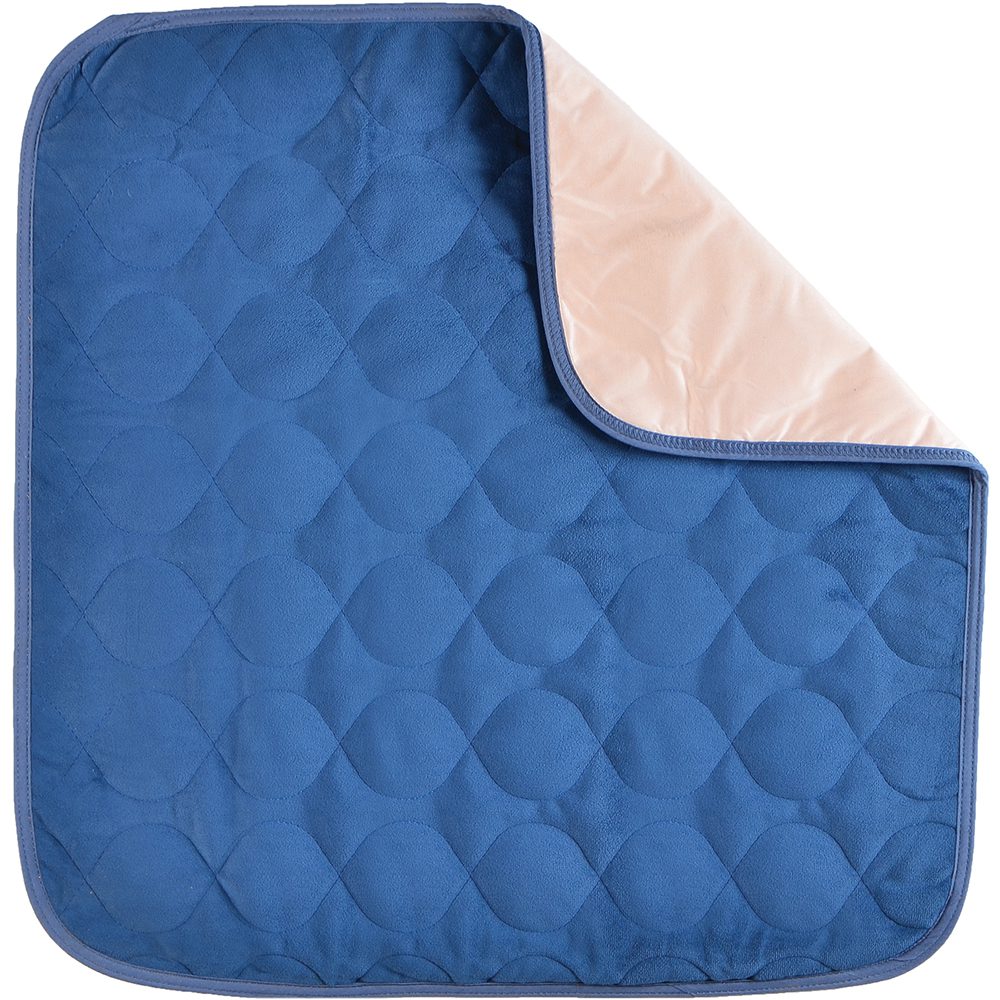 Blue quilted pet pad with folded corner