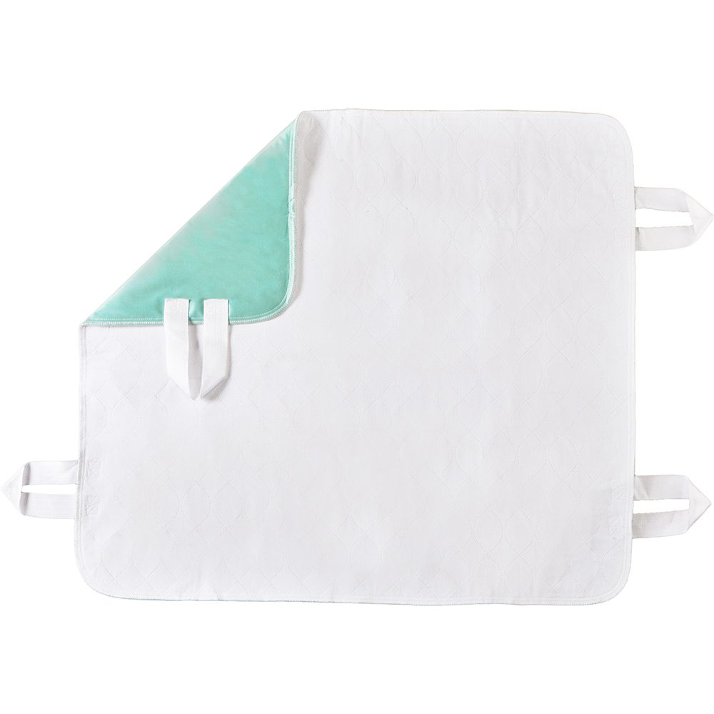Waterproof white bed pad with teal corner