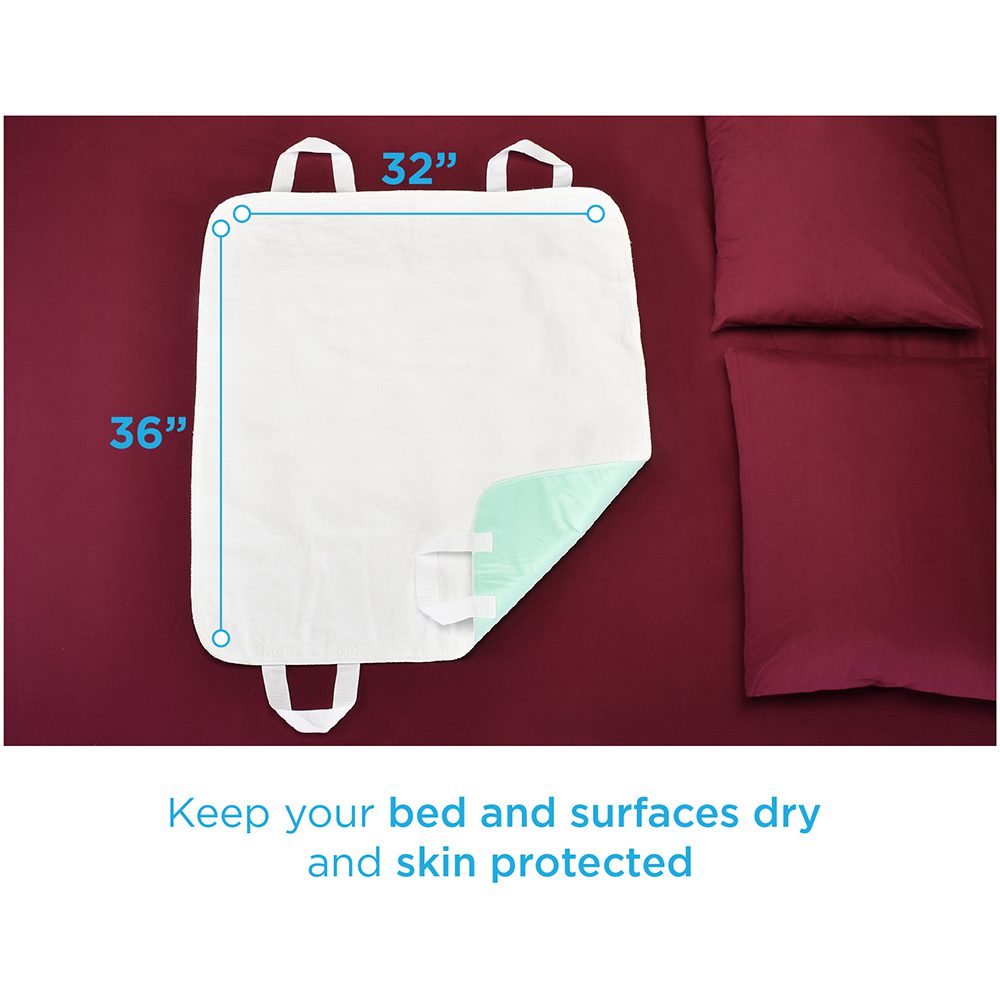 White waterproof bed pad with straps