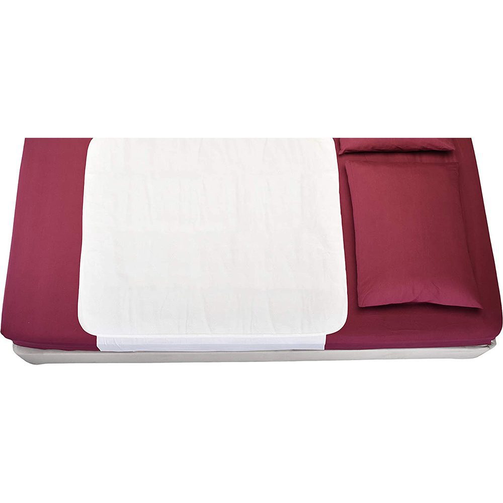 Maroon bed with white mattress protector