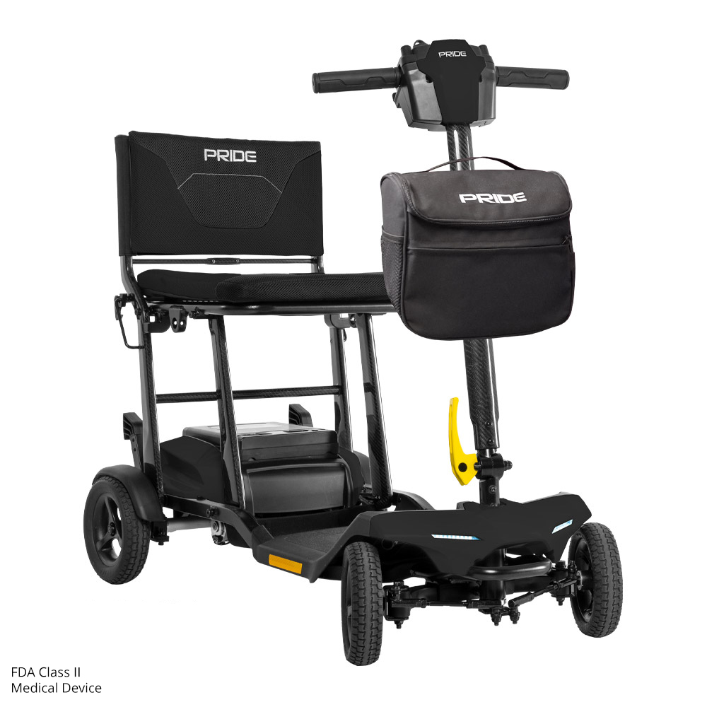 Compact electric scooter with storage bag attached.
