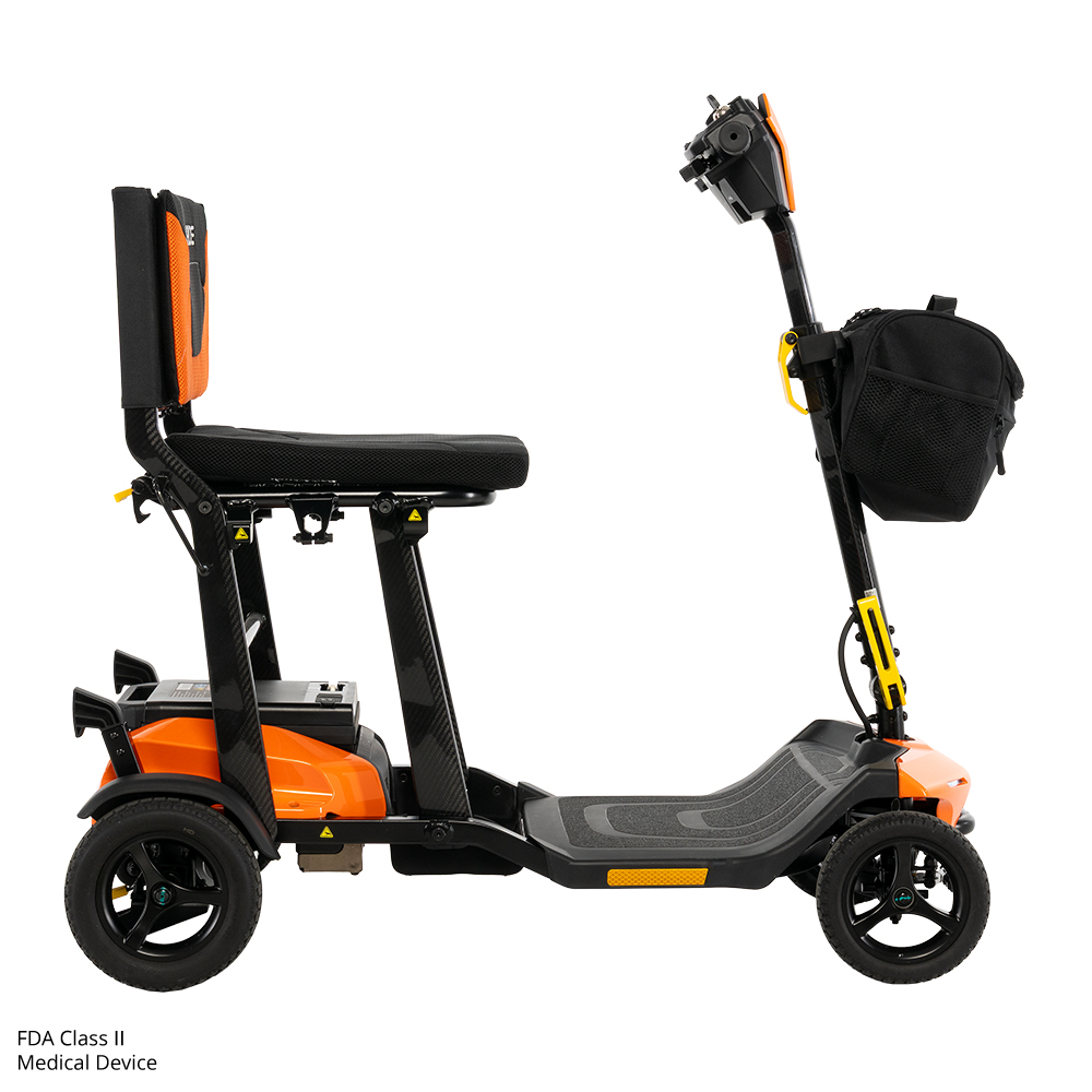 Compact orange mobility scooter with storage pouch.