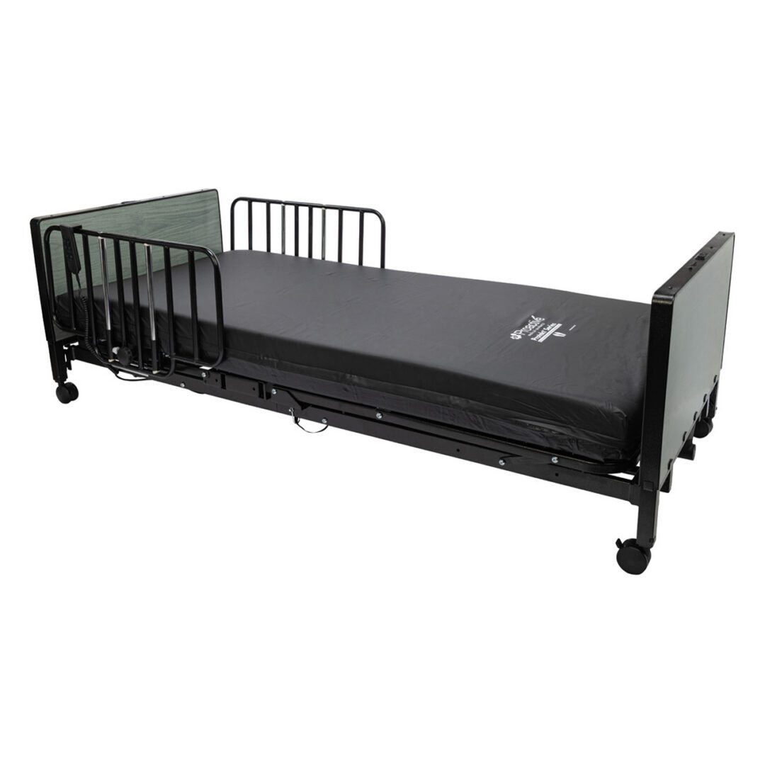 Adjustable hospital bed with safety side rails